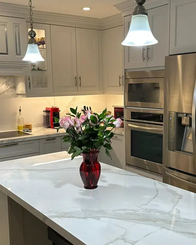 Transitional kitchen with a quartzite island and shaker cabinetry, built in Vaughan